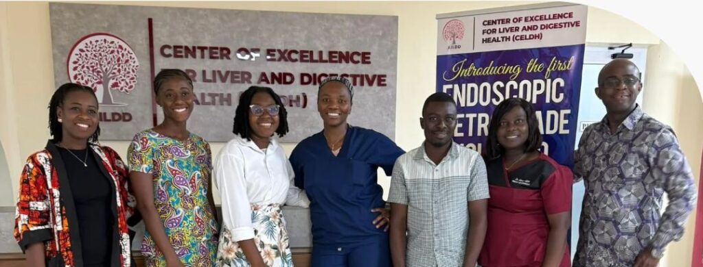 7 people stand together posing for a photo